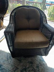 lot 3L image: Woven Outdoor Patio Chair with Brown Cushions that swivels and rocks