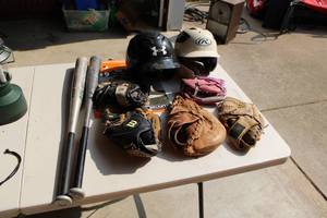 lot 60 image: Baseball Gloves Helmets and Bats