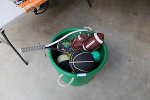 lot 61 image: Bucket pf Sports Items Tennis Racket, Basket ball, footballs frisbees Softballs etc.