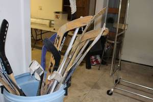 lot 73 image: Bucket of used hockey Sticks