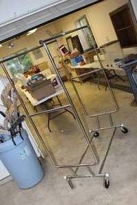 lot 74 image: Rolling Luggage Rack Clothes Rack