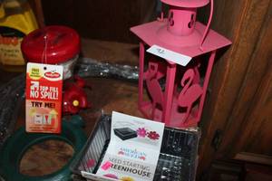 lot 92 image: Lawn Outdoor Lot, Hummingbird feeder, Seedstarter greenhouse, sprinkler, Tiki Torch Fuel Candles etc