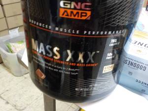 lot 34 image: 6 lb. Jug GNC Mass XXX Dietary Supp...