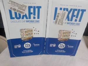 lot 58 image: 2 boxes Luz Fit Birthday Cake Bars ...