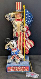 lot 38 image: Jim Shore Disney Creations From Sea to Shining Sea Mickey Mouse and Uncle Sam Carved Figurine