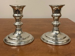 lot 55 image: Pair of Empire Pewter candle sticks