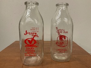 lot 65 image: 2 Glass Milk Bottles