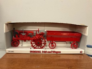 lot 135 image: Ertl Farmall F-20 and Wagon Model
