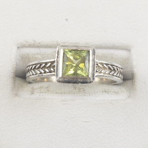 lot 38 image: Princess Cut Peridot Bezel Set Sterling Silver Ring. Size 7 - 7.25.