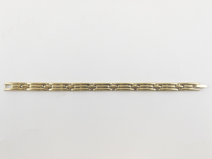 lot 60 image: Monet Ribbed Gold Tone Base Metal Link Bracelet.