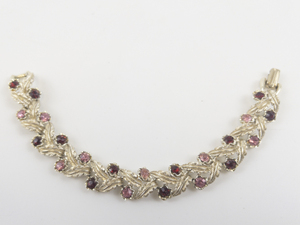 lot 62 image: Coro Vintage Pink & Red Rhinestone Accented Base Metal Leaf Link Bracelet .