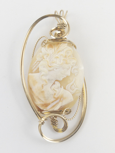 lot 71 image: Carved Shell Cameo Gold Filled Wire Wrapped Pendent (No Chain) . New Old Stock Estimated Replacement value $250