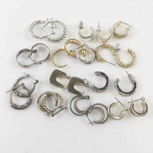 lot 83 image: Group of 12 Base Metal Hoop Earrings .