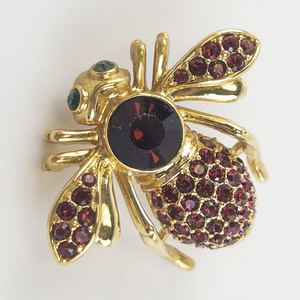 lot 89 image: Joan Rivers&nbspRed Crystal Pave base Metal Bee Brooch.