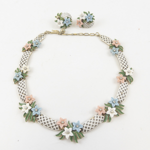 lot 97 image: Trifari  White Enamel Lattice Floral Gold Tone Base Metal Necklace & Clip-On Earrings Set.