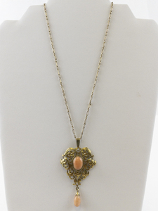 lot 101 image: Lacy Art Nouveau Coral Gold Tone Base Metal Pendant Necklace .