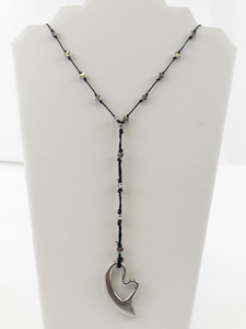 lot 102 image: String Of Hearts Silver Tone Base Metal Necklace.
