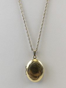 lot 113 image: Etched Oval Gold Plated locket Necklace.