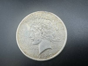 lot 27 image: 1922 Peace Dollar. Average Circulation. Honest wear and patina.