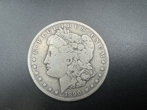 lot 40 image: 1890 O Morgan Dollar. Average circulation.