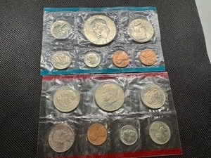 lot 113 image: 1973 & 1980 Uncirculated Sets.  Includes SBA and IKE Dollars