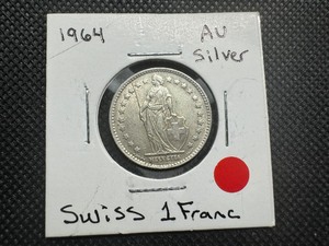lot 54 image: 1964 AU Silver Swiss 1 Franc. Honest (light) wear and patina