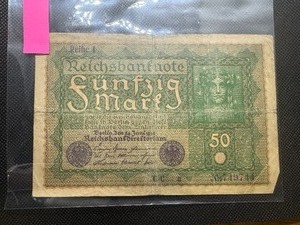 lot 60 image: 1919 Mid VF WW1 Ear German Funfzig Mark Banknote. Circulated, multiple folds, light soiling, intact corners and no margin splits