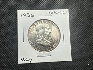 lot 90 image: 1956 Key Date, Uncirculated Franklin Half Dollar. Unbroken min luster, slight toning.