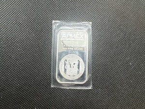 lot 92 image: 1 oz .999 Silver Apmex Bar in unopened sleeve.