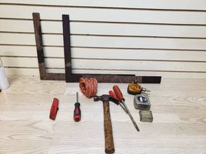 lot 40 image: Hand tools, 1 metal squares, tape measure, claw hammer, Air power palm nailer, screw drivers, utility knife