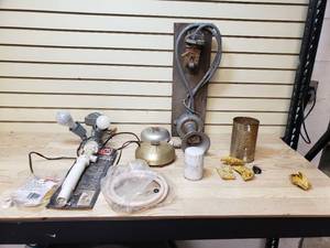 lot 48 image: Alarms, siren, motion light works, plumbing drain and fill hose, Honeywell Cadmium sulfide flame detector, oil  filter and can of hardware