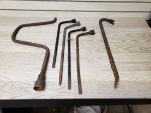 lot 50 image: Lug nut wrenches and pry bar