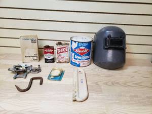 lot 55 image: Welding helmet, king of all sewer kleener, Dike cooling system protector, neatsfoot compound oil, Pan Ams world guide, Muffler clamps and more