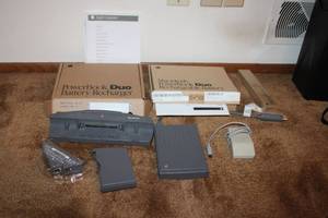lot 23 image: Apple PowerBook Duo Accessories Including Battery Recharger and MiniDock