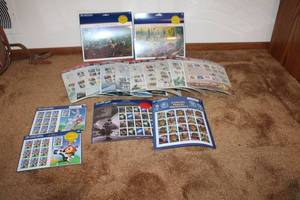 lot 31 image: Collection of US Postal Service Themed Stamp Sheets