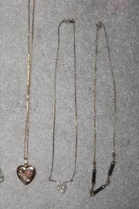 lot 49 image: Elegant 3-Piece Necklace Set Heart Locket, Pearl, and Bead Design