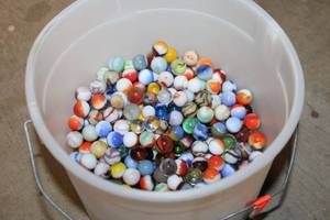 Collection of Assorted Colorful Marbles in Bucket