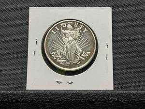 lot 61 image: One Ounce .999 Fine Silver Round with Liberty and Eagle Design
