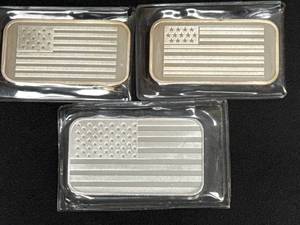 lot 119 image: Three One-Ounce .999 Fine Silver Bars by The Washington Mint with American Flag Design