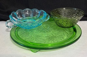 lot 85 image: Vintage Jeanette Green Sunflower Footed Cake Plate, Anchor Hocking Soreno Avacado Green Glass Bowl and Anchor Hocking Fairfield Aqua Blue Dish