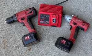 lot 231 image: Milwaukee 12 Drill Driver, Impact Driver and Charger