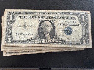 lot 56 image: 25 $1 Dollar Silver Certificates