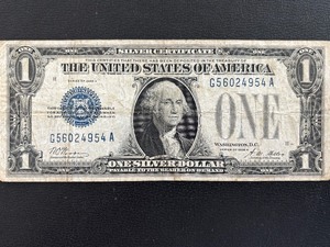 lot 61 image: 1928 A Blue Seal $1 Dollar Silver Certificate Funnyback