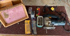 lot 12 image: Bosch 1587VS Jig Saw w New & Used Blades in Good Working Condition