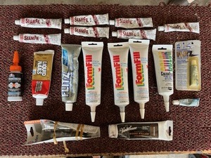 lot 29 image: Lot of Flitz Metal Polich, Liquid Nails, SeamFil, and More