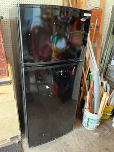 lot 44 image: Used AMANA Black Refrigerator (67.5 T x 28.5 D x 28 W) in Good Working Condition