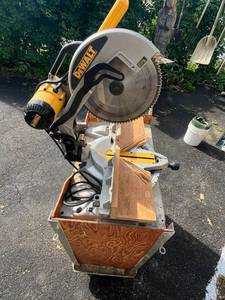 lot 74 image: DeWalt 12 Double Bevel Compound Miter Saw (Model DW706) w Rolling Cart in Good Working Condition