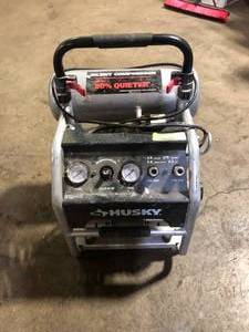 lot 19 image: Husky 4.5 Gal. 175 PSI Portable Electric Oil-Free Quiet Twin Stack Jobsite Air Compressor wRubber Wheels and 2-Quick Couplers For Parts Customer Returns See Pictures
