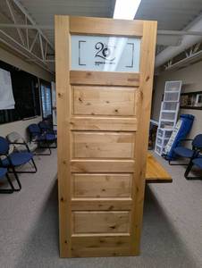 lot 44 image: Heritage Millwork Custom 26x68 Knotty Alder Interior Door  5-Panel Design with Satin Glass Insert. One-of-a-Kind Piece That Can Be Used Functionally or Decoratively.