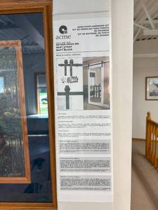 lot 61 image: MSRP $175 NEW IN BOX Acme Barn Door Hardware Kit BD102K-09600-MB Bent Strap Model  Matte Black Finish. Designed for Smooth Installation of Sliding Barn Doors. Add Rustic Charm with Modern Functionality